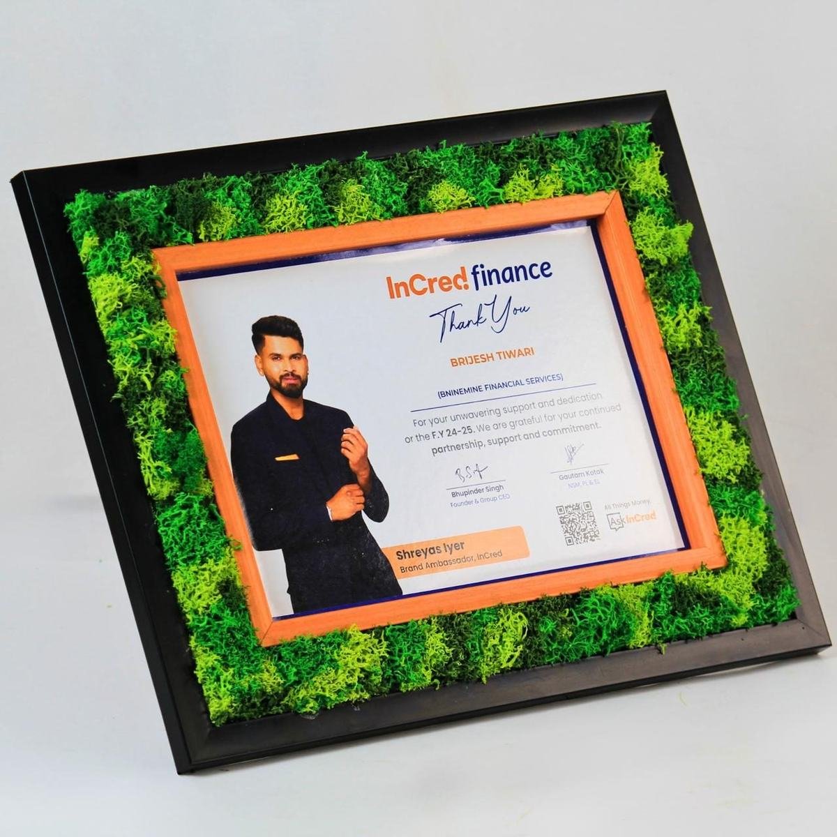 Moss frame around a personalised certificate